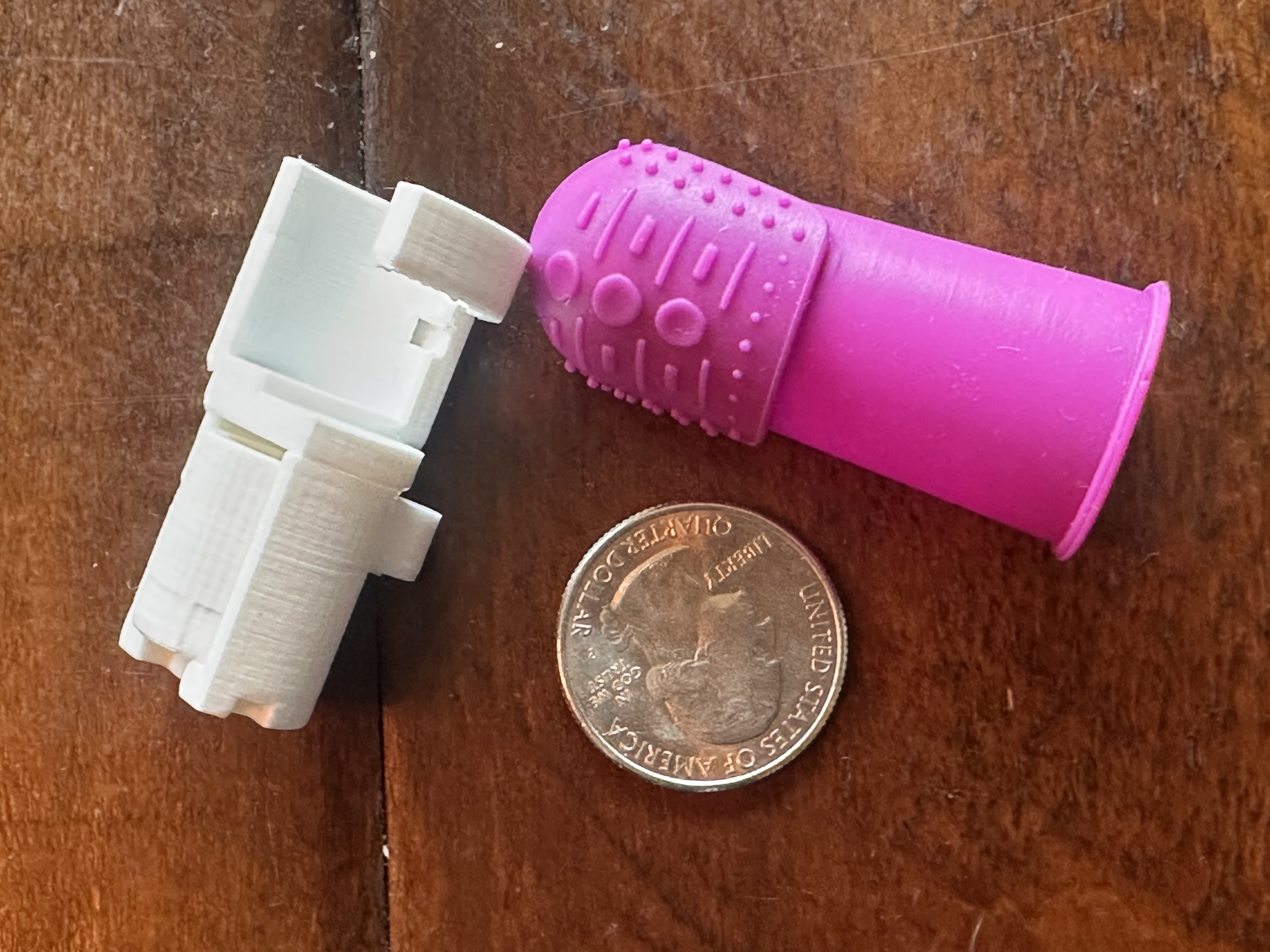 Pudendal Nerve Block Device — 3D-printed prototype components with quarter for scale