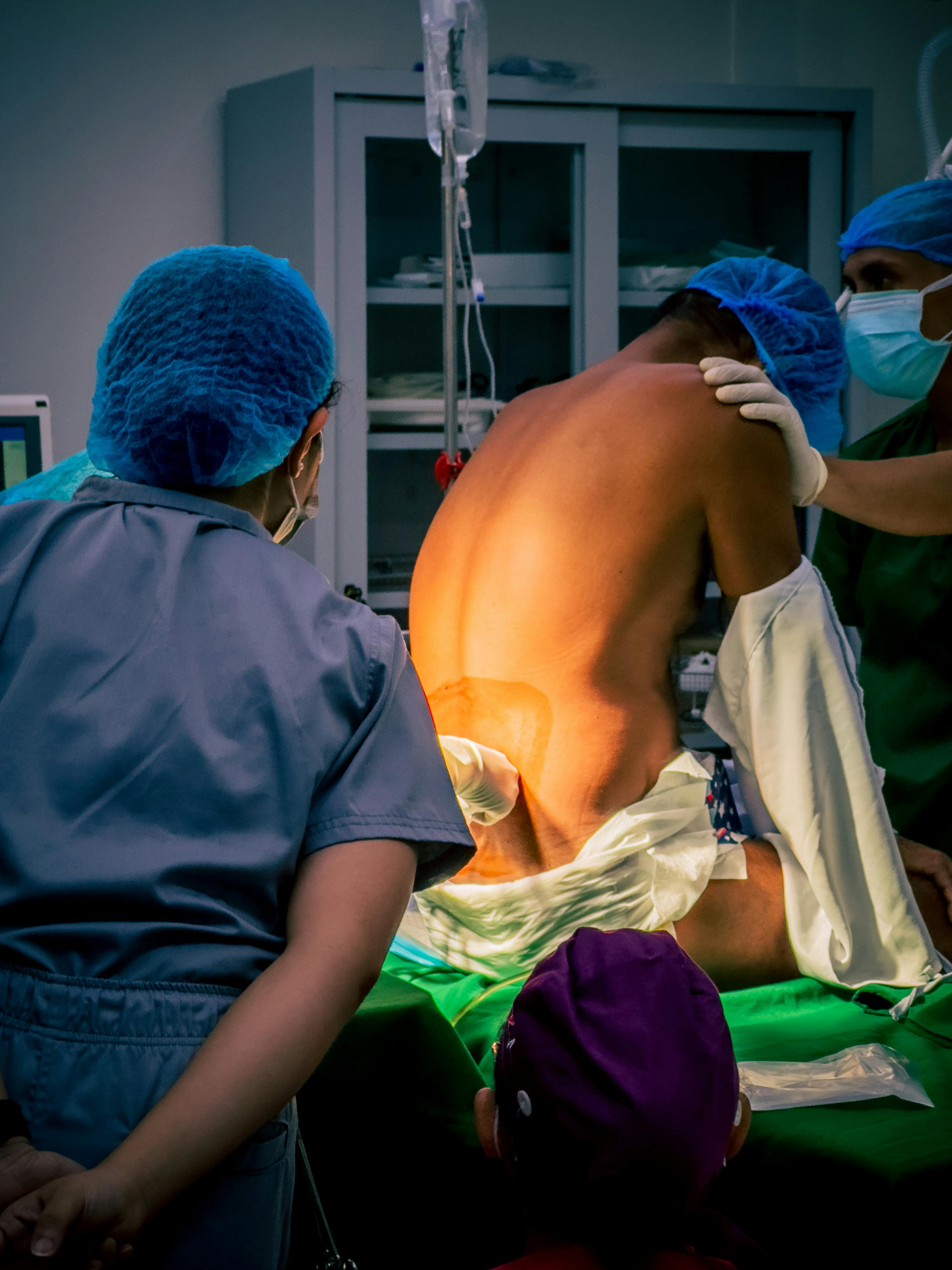 Surgical team performing a procedure — interventional analgesia