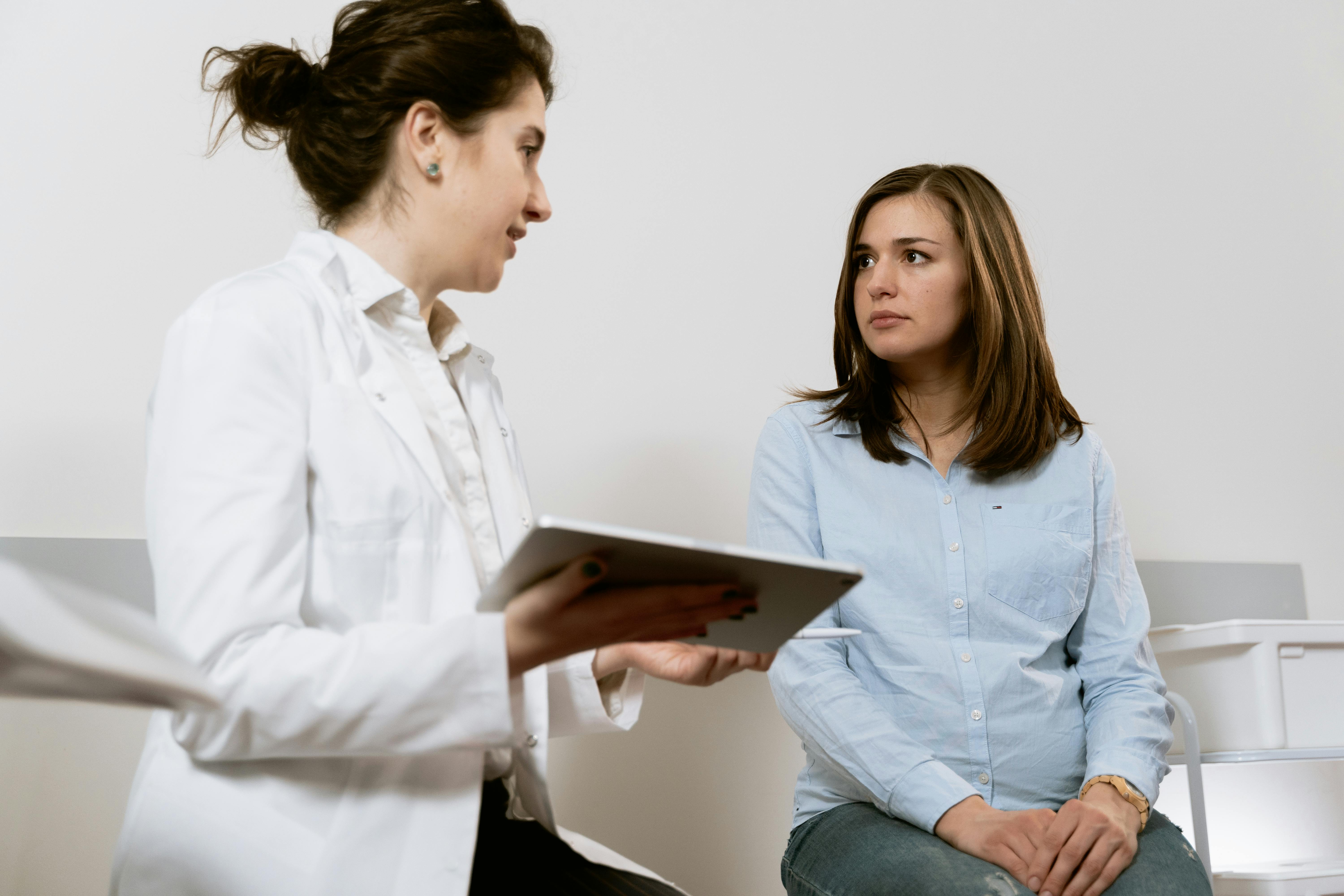 Physician consulting with a patient — personalized women's health care