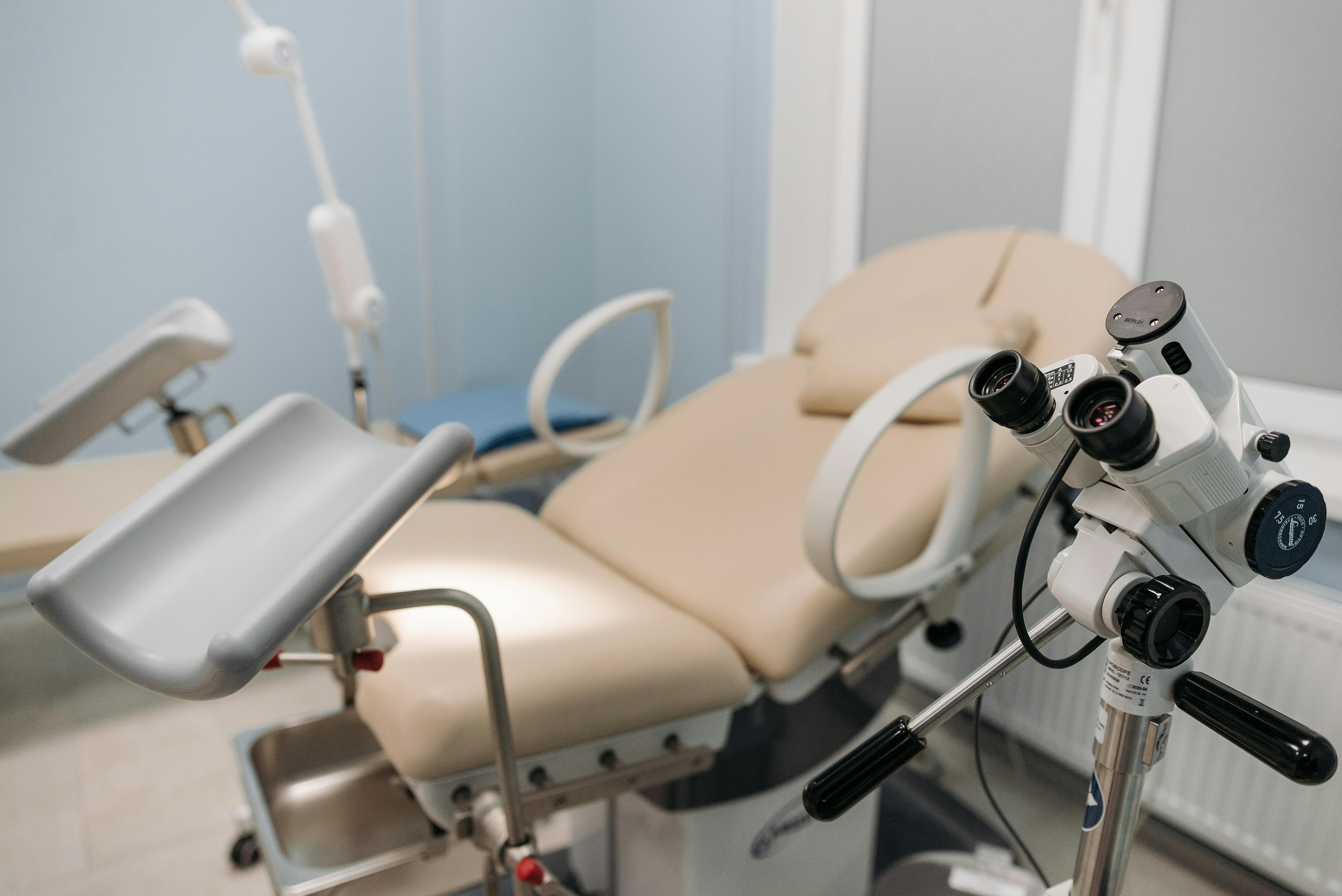 Gynecological examination suite with colposcope — clinical environment